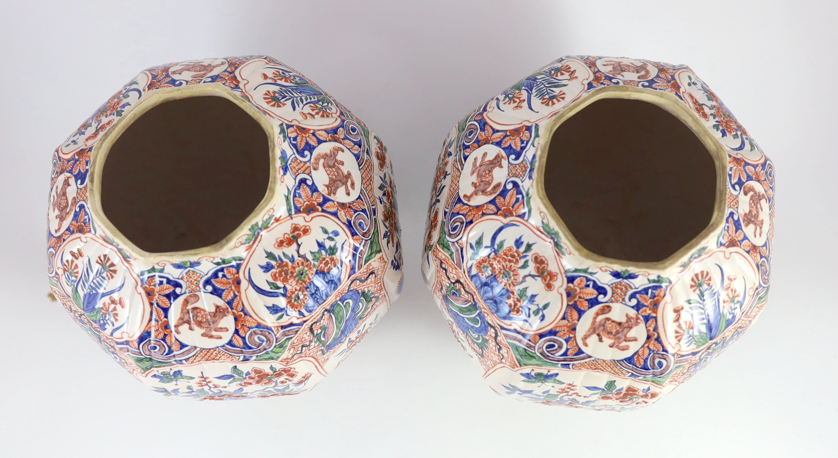 A pair of large Delft jars and covers, Pieter Kocx factory De Grieksche A, c.1701-1722, 50.5cm high, damage to covers